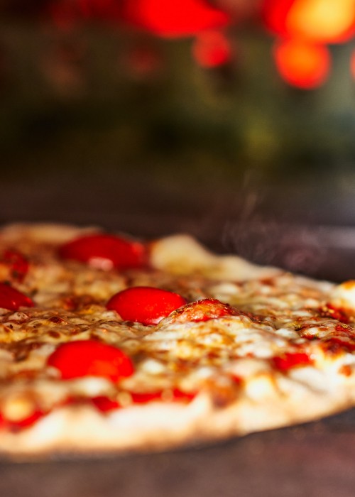 Fresh, handmade, wood-fired pizzas made by Magic 5 Pizza team