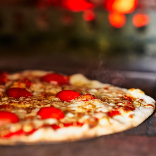 Fresh, handmade, wood-fired pizzas made by Magic 5 Pizza team
