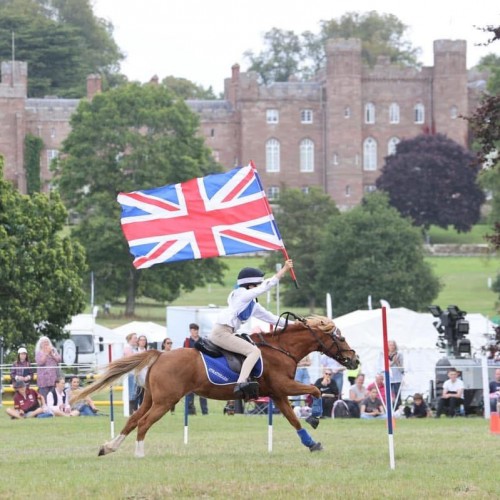 Pony Club Mounted Games young riders race against  demonstrating speed,  accuracy and horsemanship